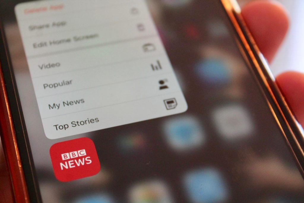 BBC News App on phone, which Huw Edwards anchored