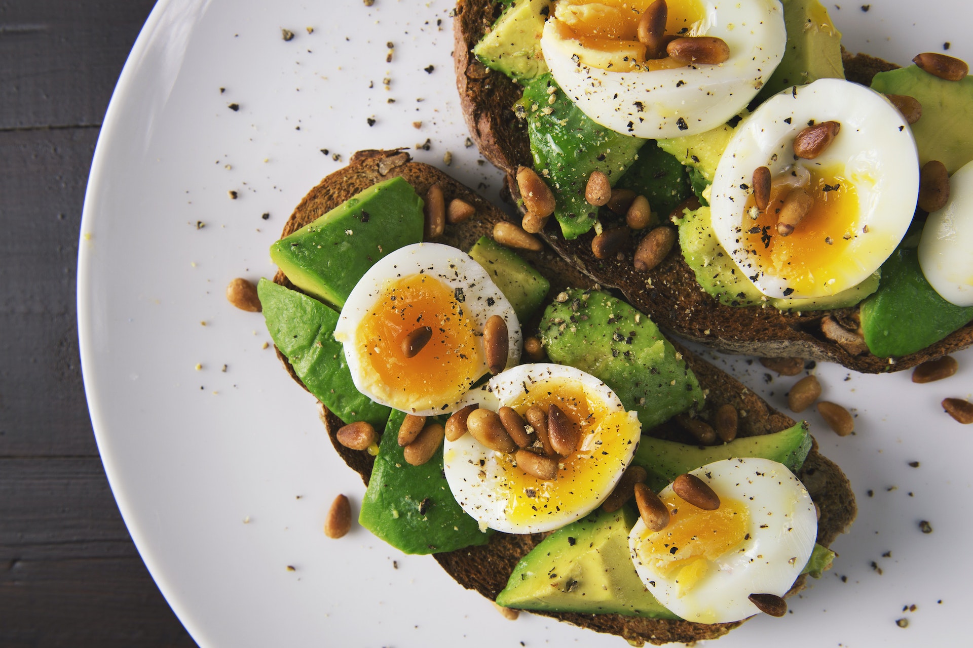 An eggs and avocado on bread meal within certain diet plans