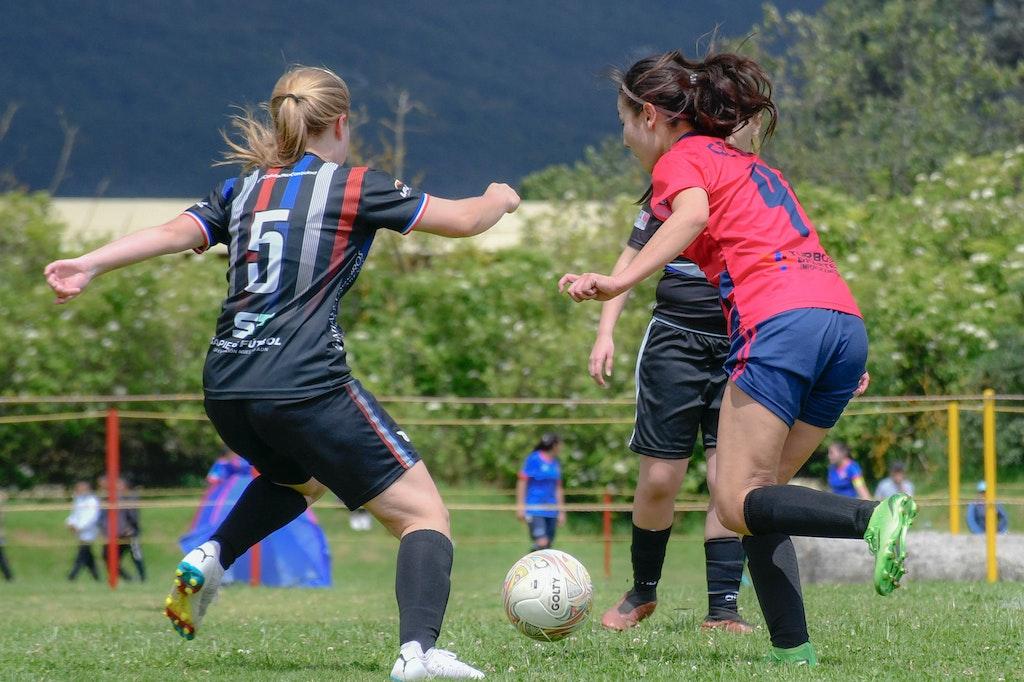 Image of girls playing football inspired by the women's world cup 2023