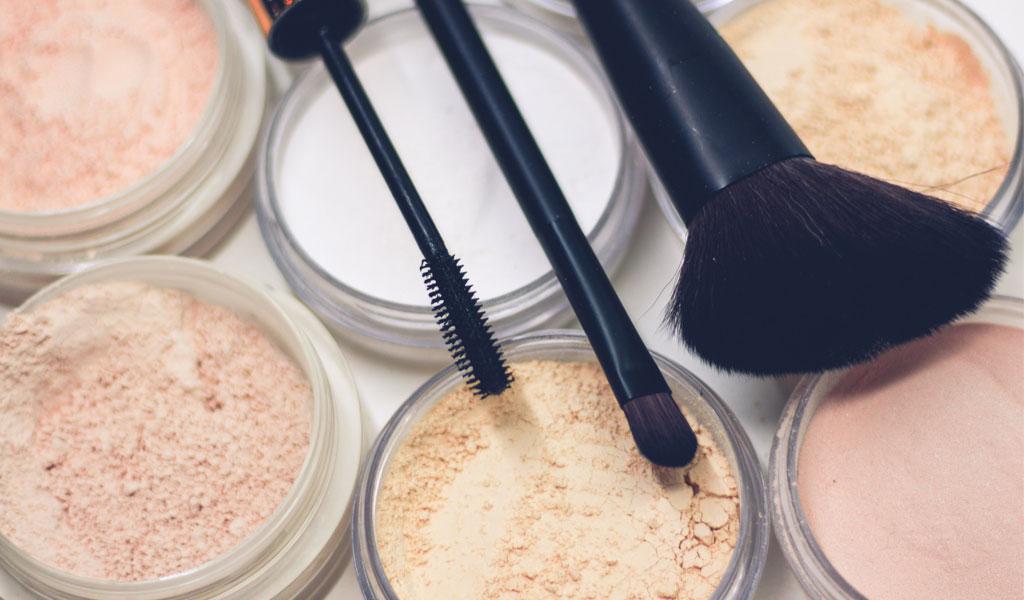 Image of make-up kit - powders and brushes.